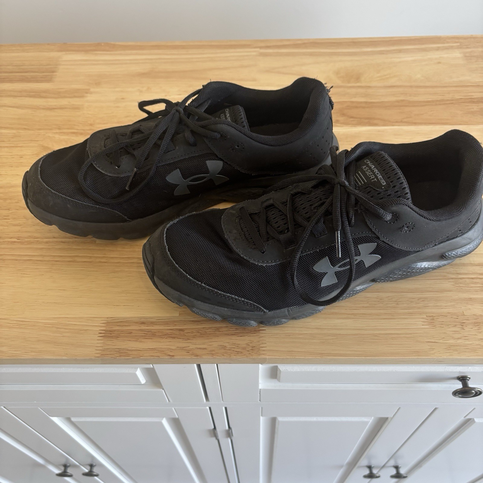 Black Under Armour Charged Assert 10 Men’s Athletic Shoes