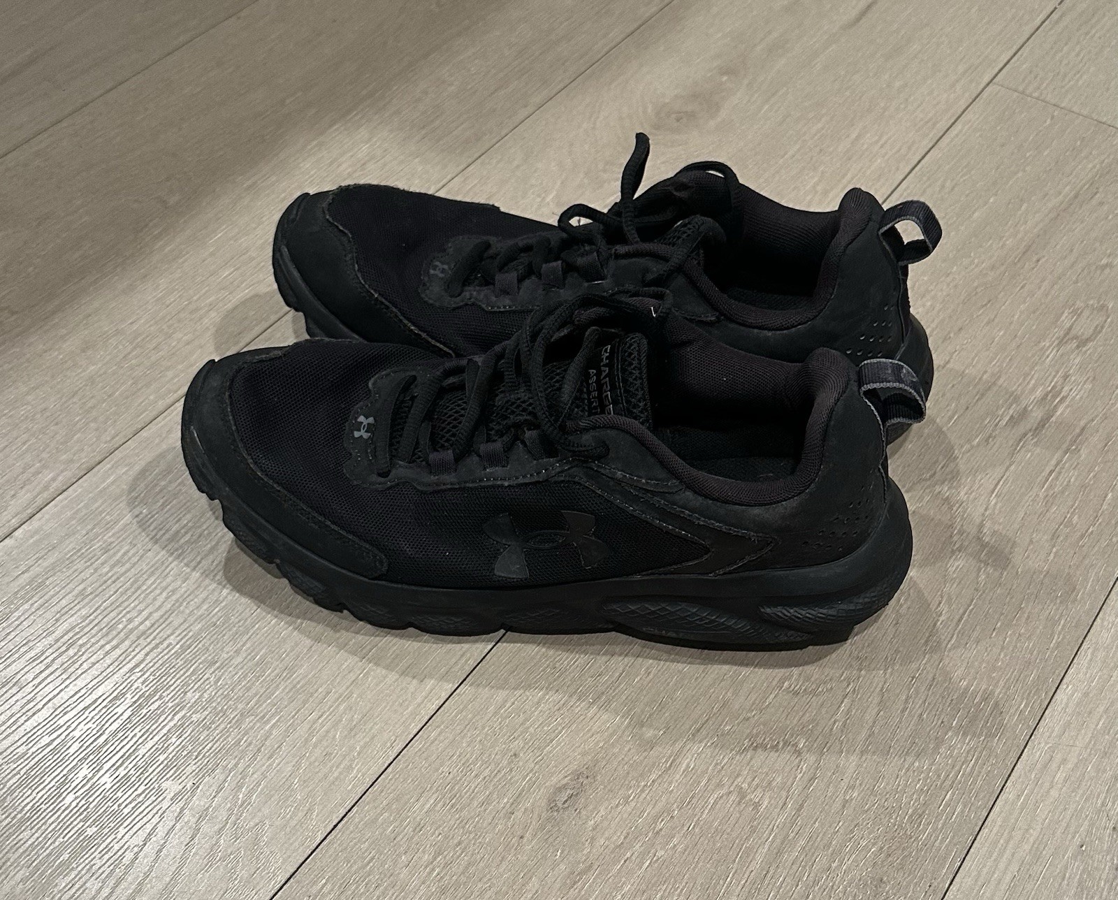 Under Armour Men’s Charged Assert 9 running shoes in black Size 10