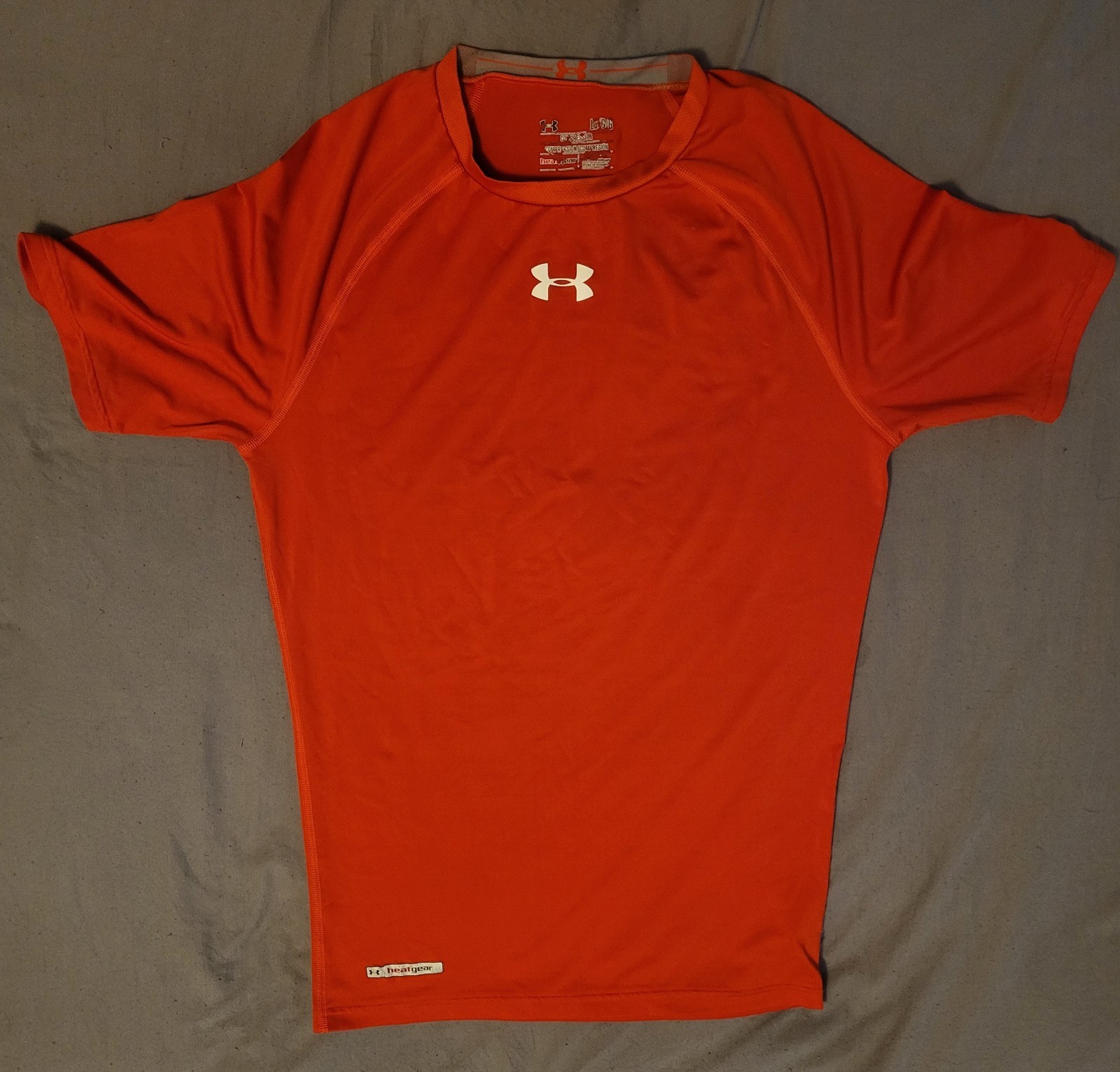 Under Armour Men’s HeatGear Short Sleeve Compression Sz Large, Feels M, Orange.